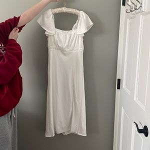 White dress, chin length with slit in the front, medium, silk like fabric